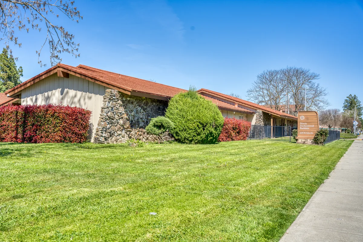 Thrive Dental Dixon office with green lawn and stone facade