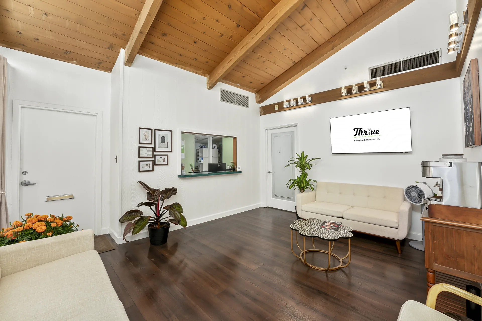 Warm reception area with wood accents at Thrive Dental Santa Clara