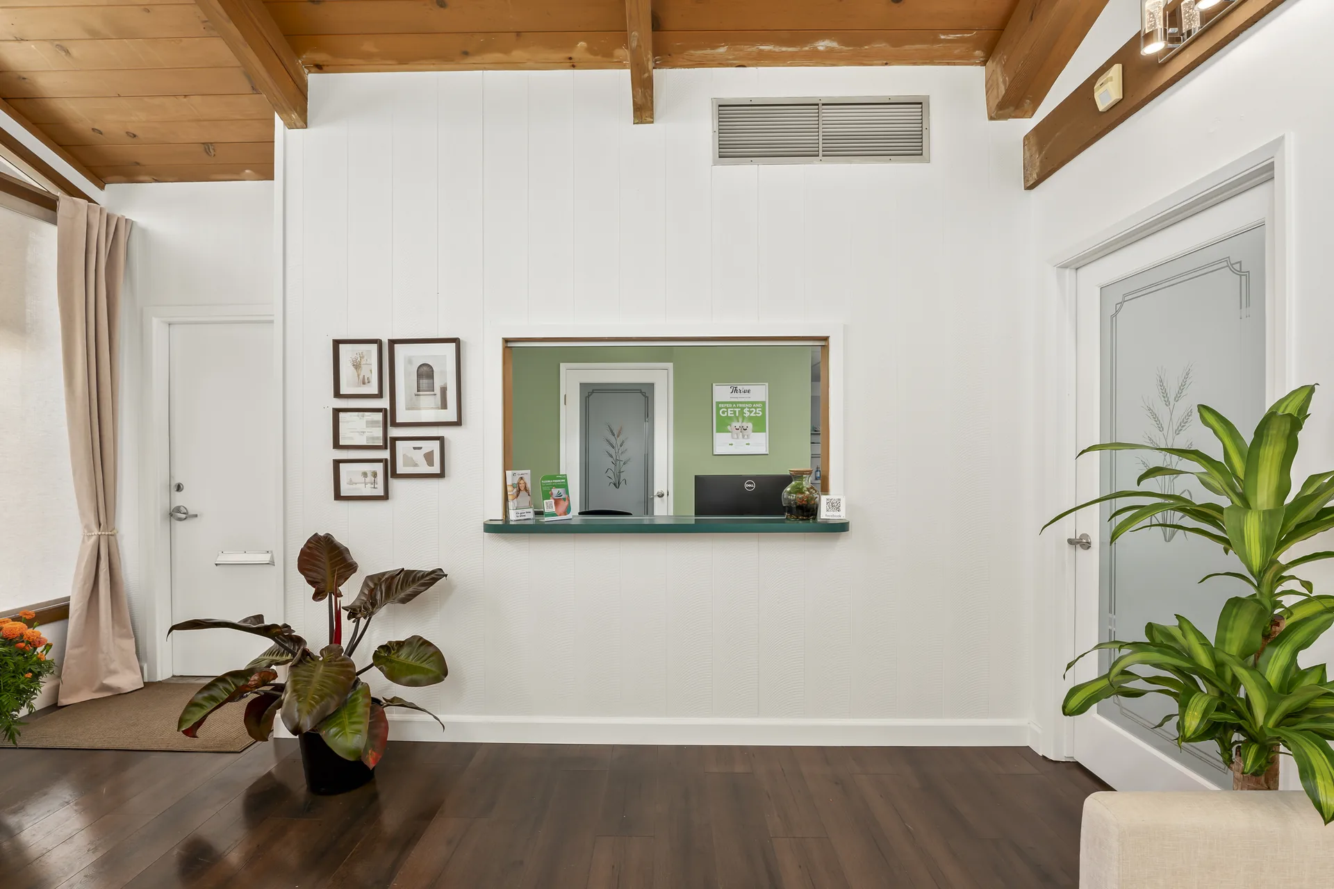 Welcoming interior with vaulted wood ceiling and plants at Thrive Dental Santa Clara